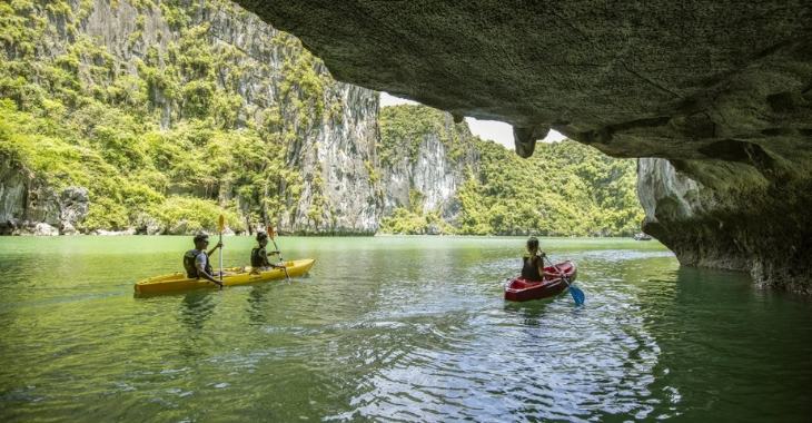 Luon Cave invites visitors to paddle through a narrow water tunnel into a peaceful lagoon